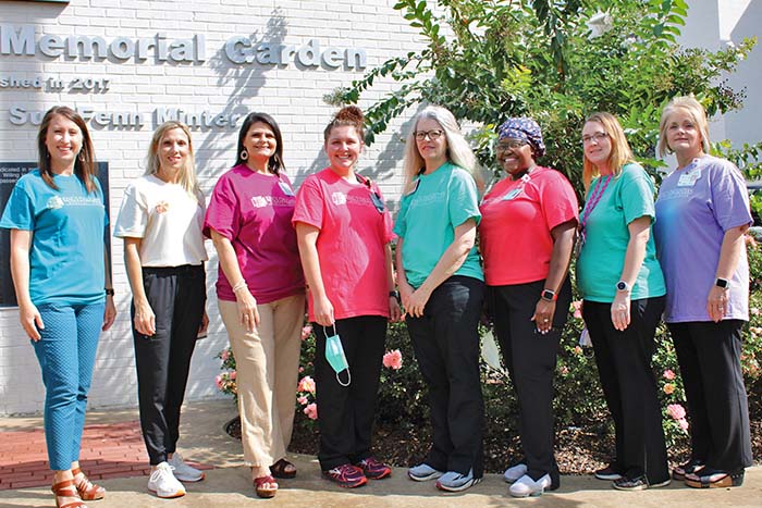 8 women wearing t shirts